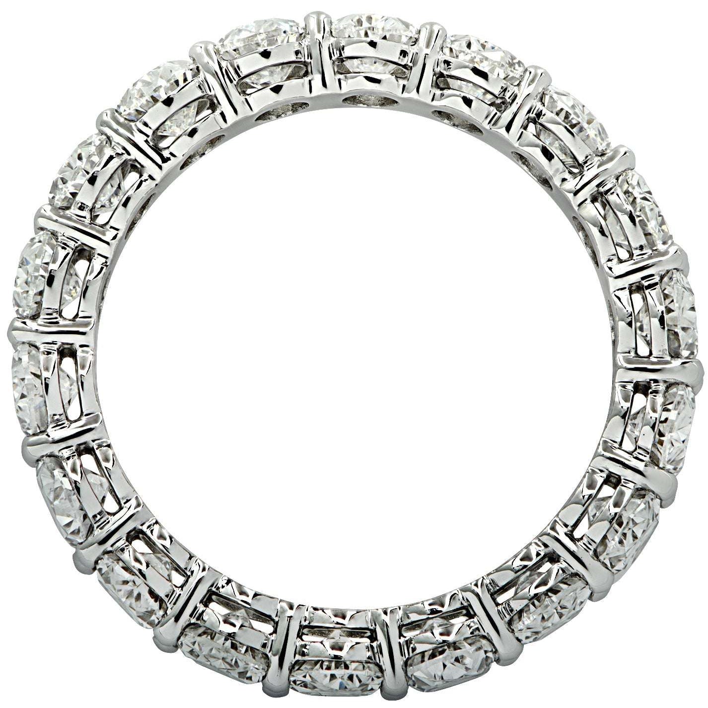 Timeless 4.33 Carat Oval Cut Diamond Eternity Band in Platinum by Vivid Diamonds, featuring a brilliant circular arrangement of high-quality diamonds.