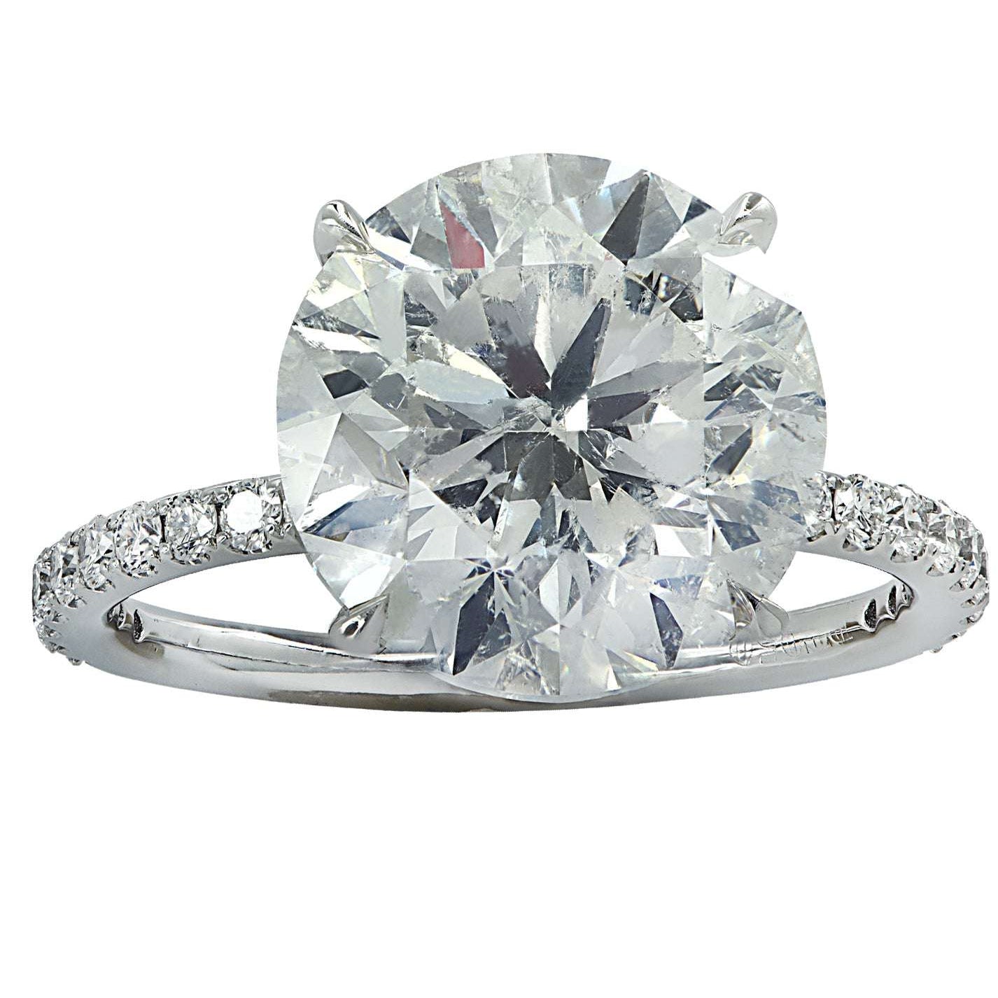 Exquisite Vivid Diamonds 6.20 Ct Platinum Engagement Ring showcasing a dazzling round brilliant cut diamond and shimmering accent diamonds, perfect for celebrating love and commitment.