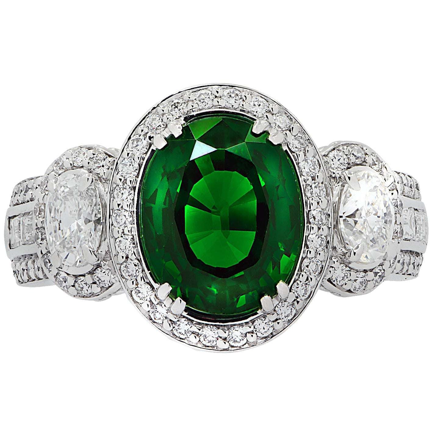 Close-up view of the Vivid Diamonds 3.38Ct Oval Cut Tsavorite & Diamond Halo Ring in 18K White Gold, showcasing the vivid green Tsavorite and diamond accents for a luxurious appeal.