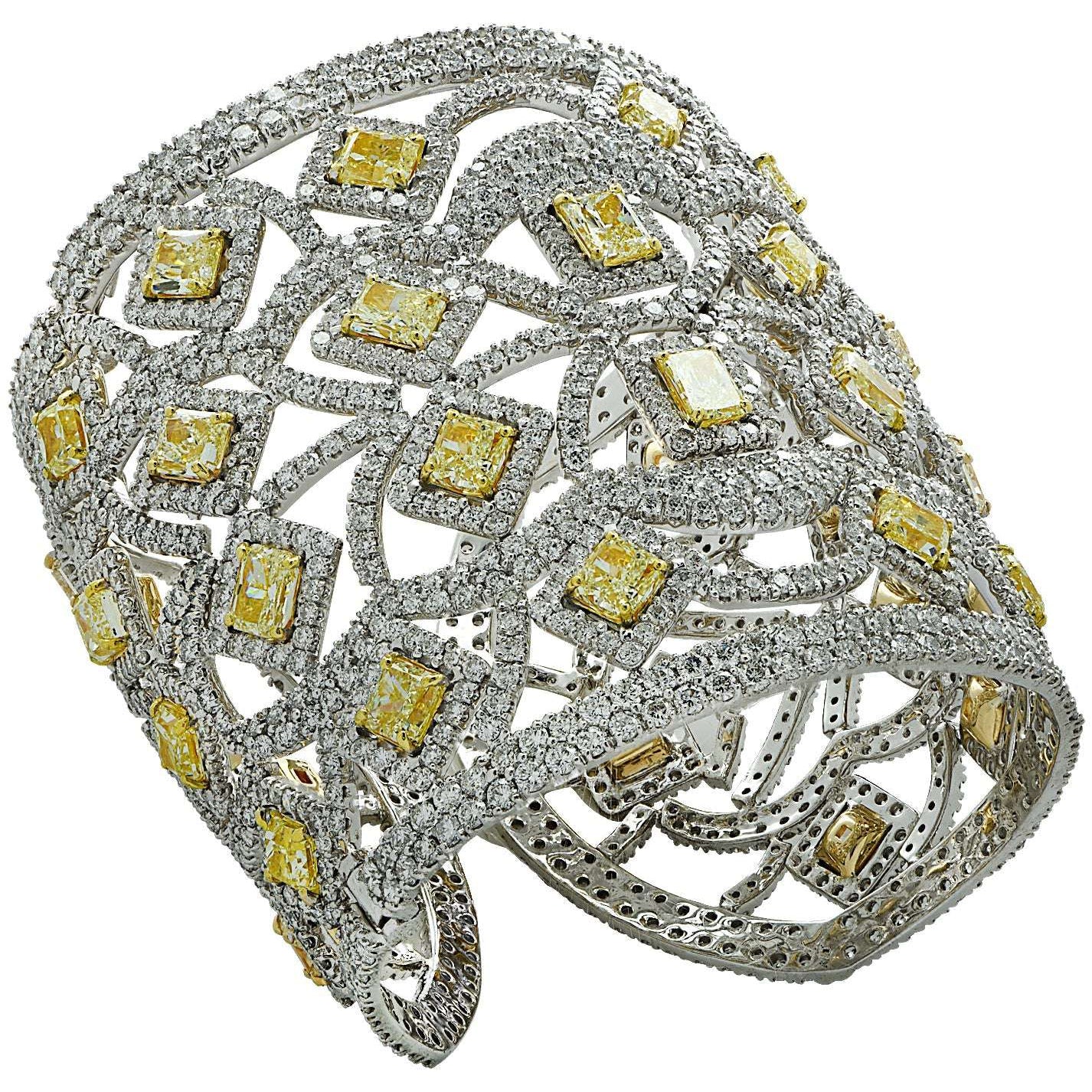 Stunning 72.44 Carat Fancy Yellow Diamond Cuff Bangle by Vivid Diamonds, crafted in 18K White and Yellow Gold, featuring intricate open metalwork design embellished with radiant cut and round brilliant cut diamonds.