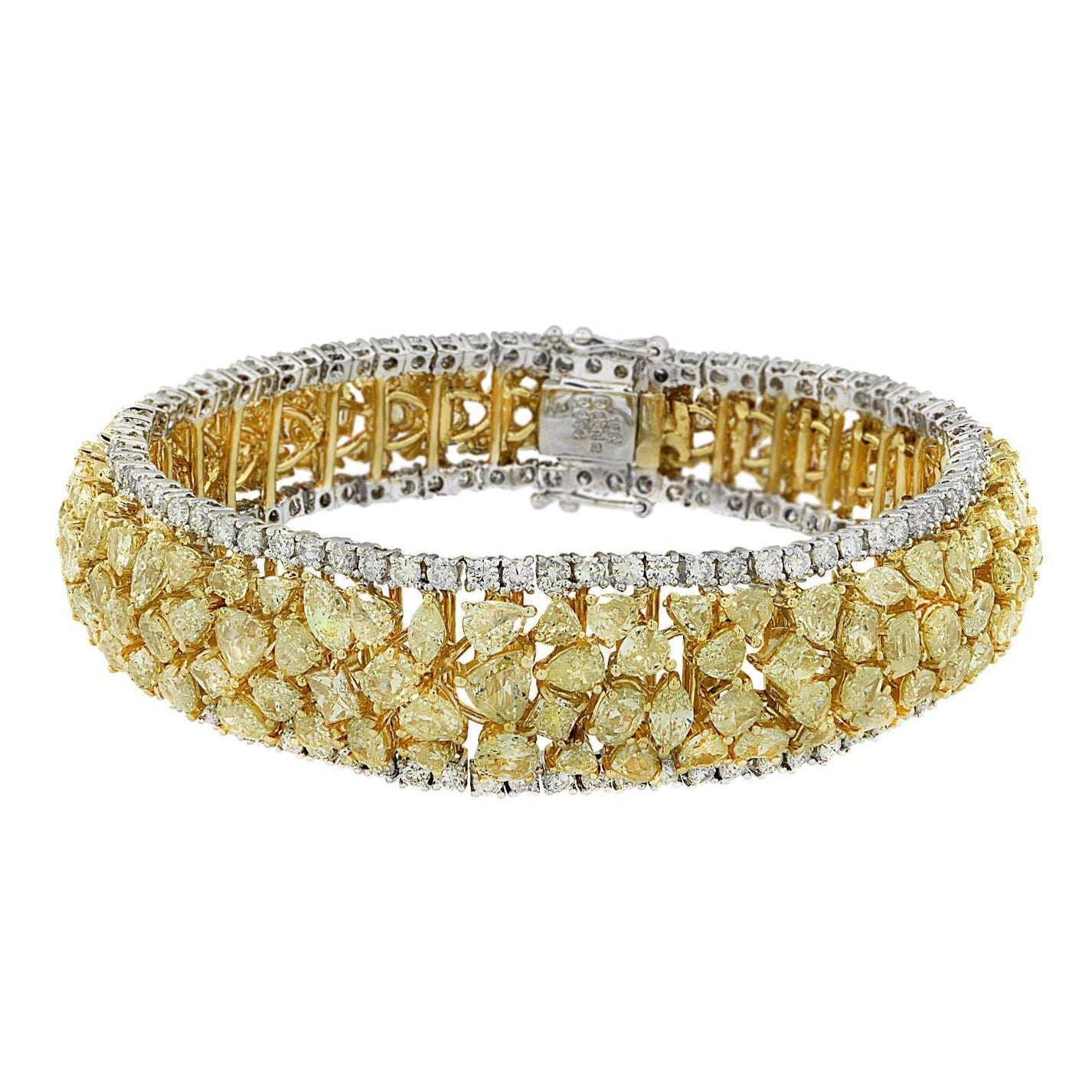 VIVID 23Ct Fancy Yellow Diamond Bracelet by Vivid Diamonds, featuring 153 mixed-cut Fancy Yellow diamonds in 18K Yellow and White Gold with 144 white diamond accents.