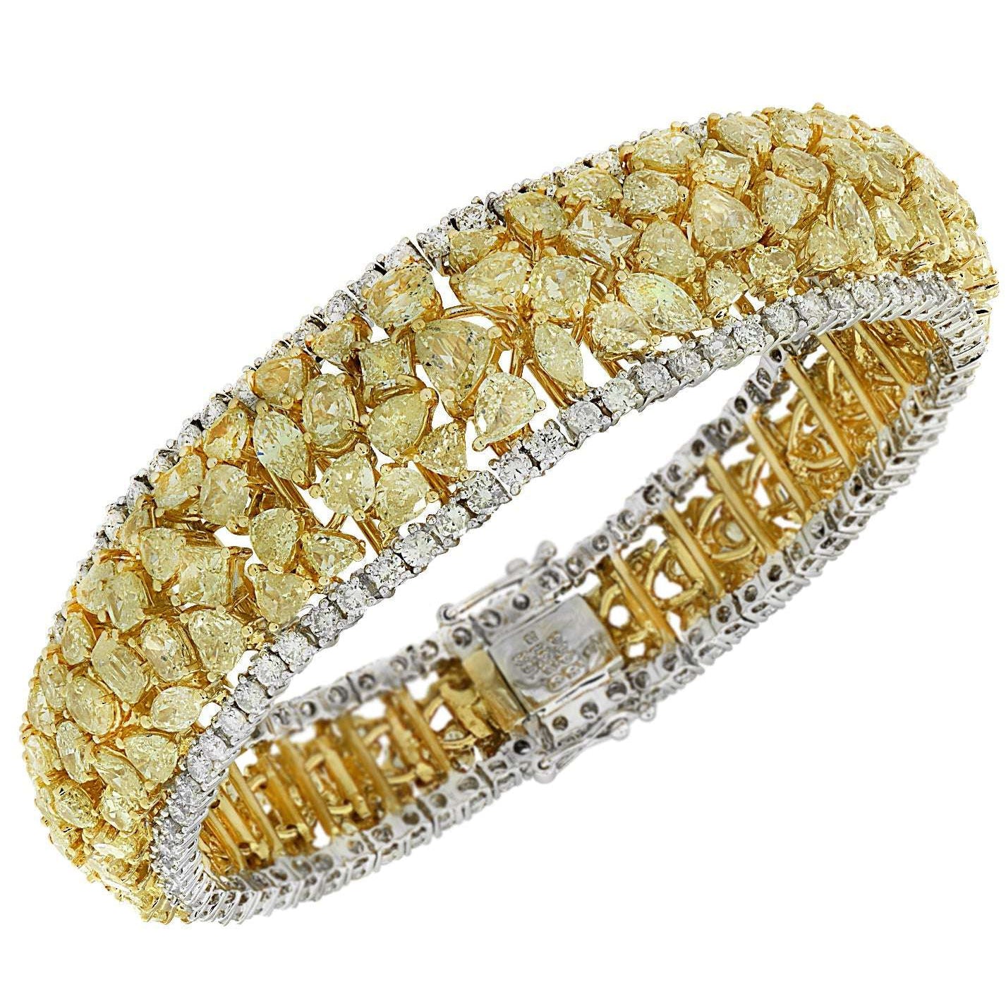 VIVID 23Ct Fancy Yellow Diamond Bracelet in 18K Yellow & White Gold by Vivid Diamonds, featuring an array of vibrant yellow diamonds and white diamond accents in an exquisite design.