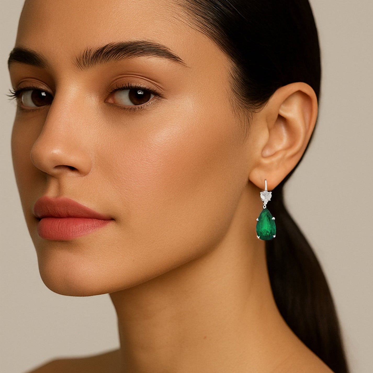 Elegant model wearing Vivid Diamonds GIA Certified 7.88ct Colombian Emerald & 2ct Diamond Dangle Earrings, emphasizing the stunning emerald color and luxurious design, perfect for enhancing beauty and sophistication.