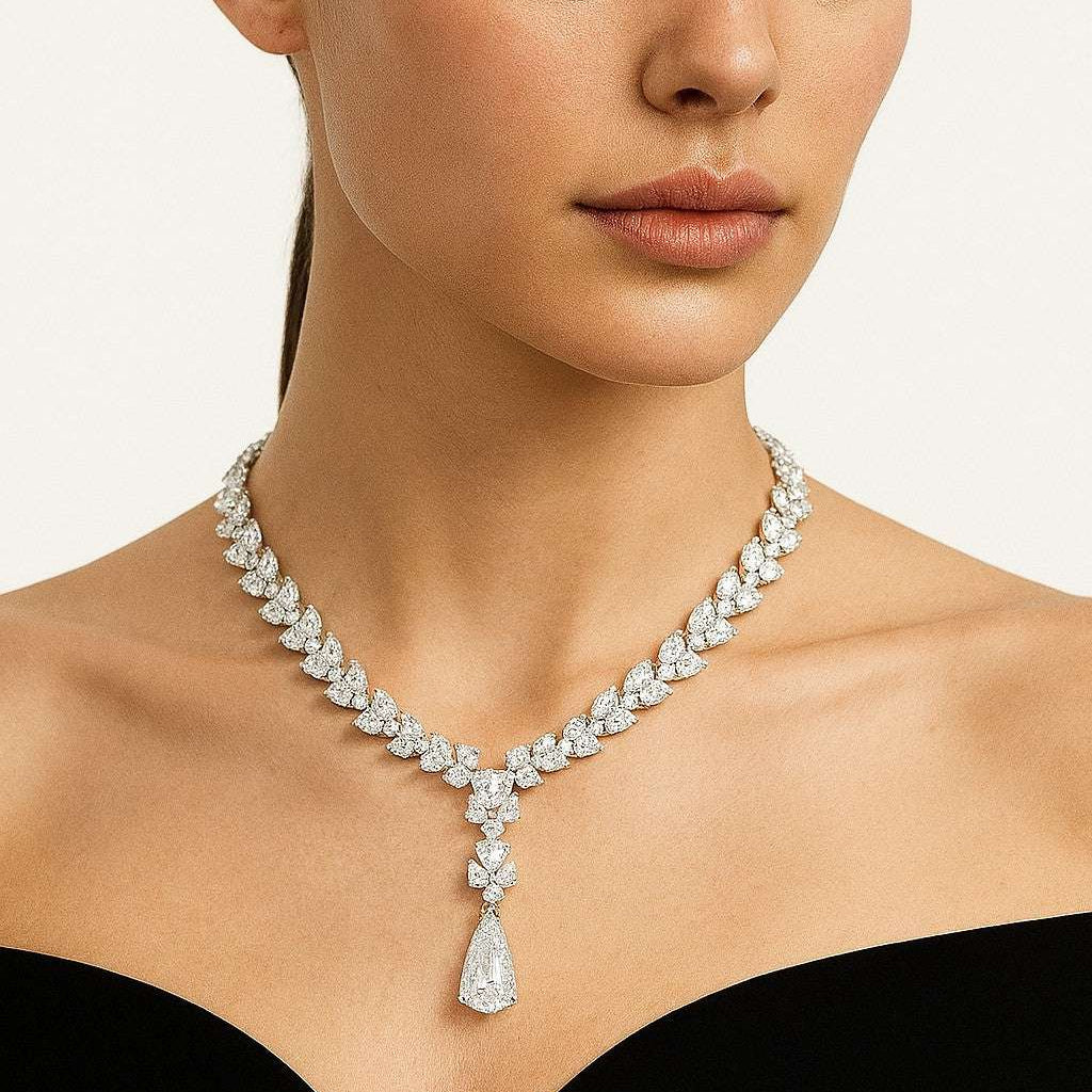 Elegant Vivid Diamonds 56 Carat Platinum Diamond Drop Necklace displayed on a model, showcasing the exquisite design and radiant diamonds that enhance sophistication.
