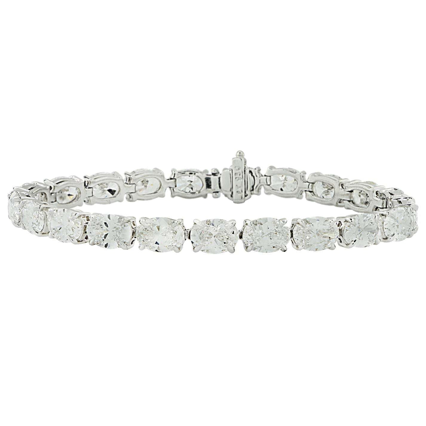Sophisticated look at the GIA Certified 21.20 Ct Oval Cut Diamond East-West Tennis Bracelet in Platinum by Vivid Diamonds, highlighting the exquisite craftsmanship and luxurious design of this diamond bracelet.