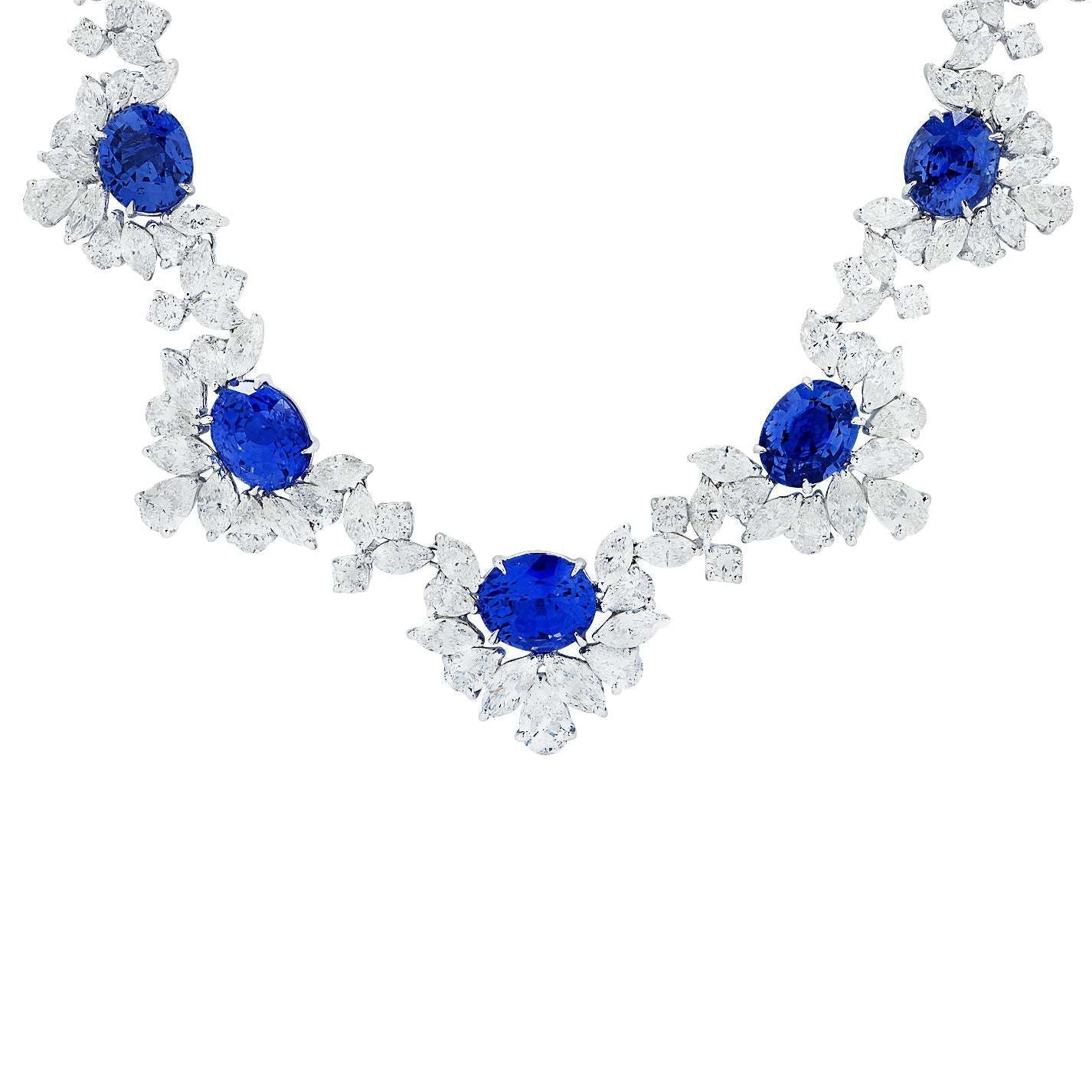 Exquisite 40ct Oval-Cut Sapphire and 42.5ct Diamond Necklace in Platinum by VIVID Diamonds, showcasing vibrant blue sapphires surrounded by luxurious diamond accents, perfect for elegant occasions.