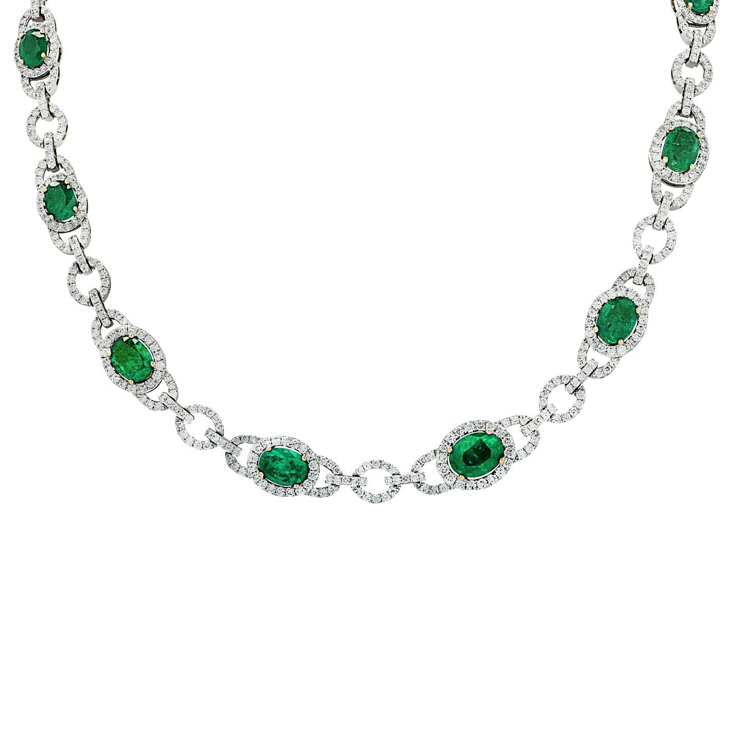 18K White Gold Diamond and Emerald Necklace featuring 12.28 carats of emeralds and 7.92 carats of diamonds, crafted by Vivid Diamonds. A luxurious piece showcasing a stunning design with vibrant emeralds surrounded by sparkling diamonds.