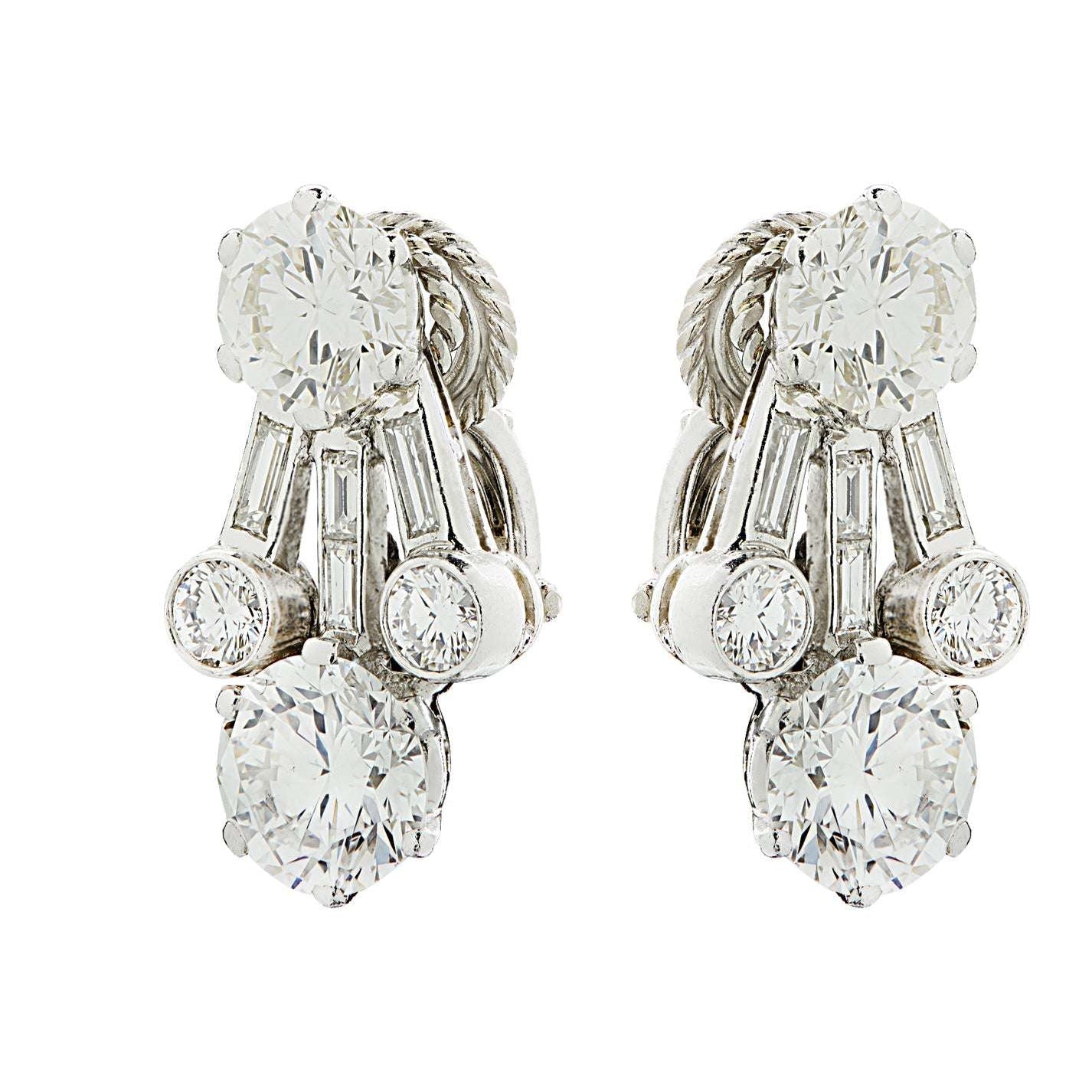 Stunning Harry Winston 4.65 Ct Diamond Clip-On Earrings in Platinum adorned with round and baguette cut diamonds, designed by Vivid Diamonds.