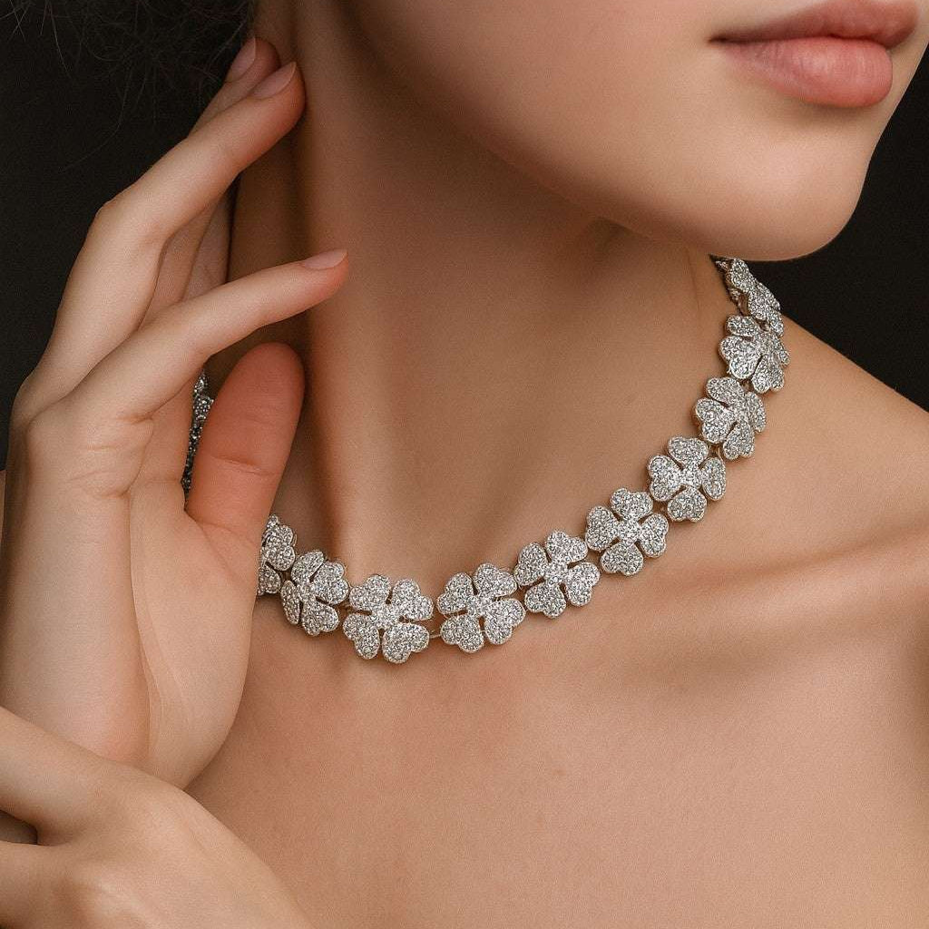 Elegant model wearing the Cartier Pave Diamond Clover Necklace from Vivid Diamonds, featuring intricate diamond clover motifs in luxurious 18k white gold.