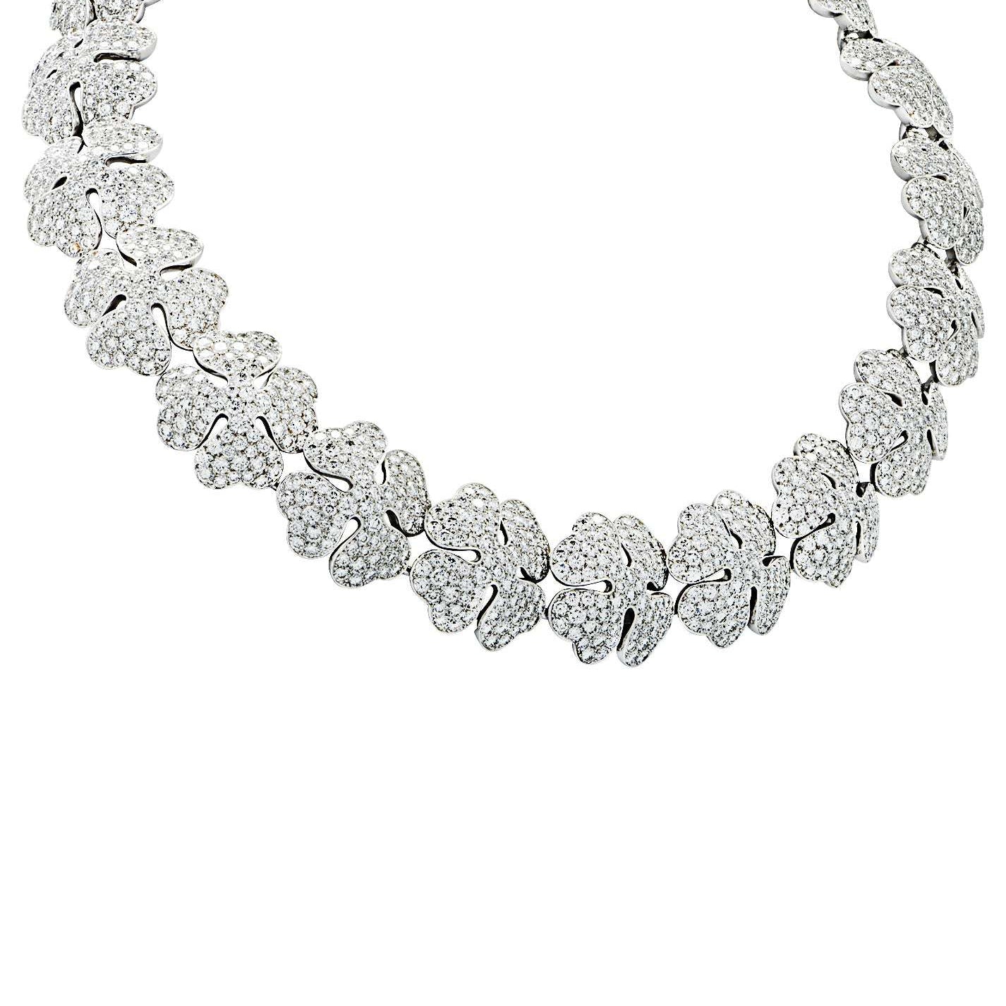 Stunning close-up of the Cartier Pave Diamond Clover Necklace by Vivid Diamonds, highlighting the intricate design and brilliance of the diamonds set in 18k white gold.