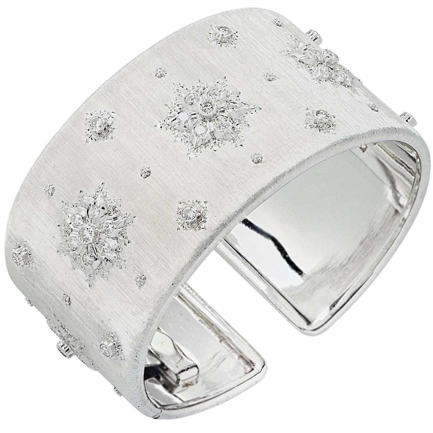 Luxury Buccellati Italy 18K White Gold Diamond Wide Cuff Bangle showcasing intricate star motifs and hand-engraved finish, available from Vivid Diamonds.