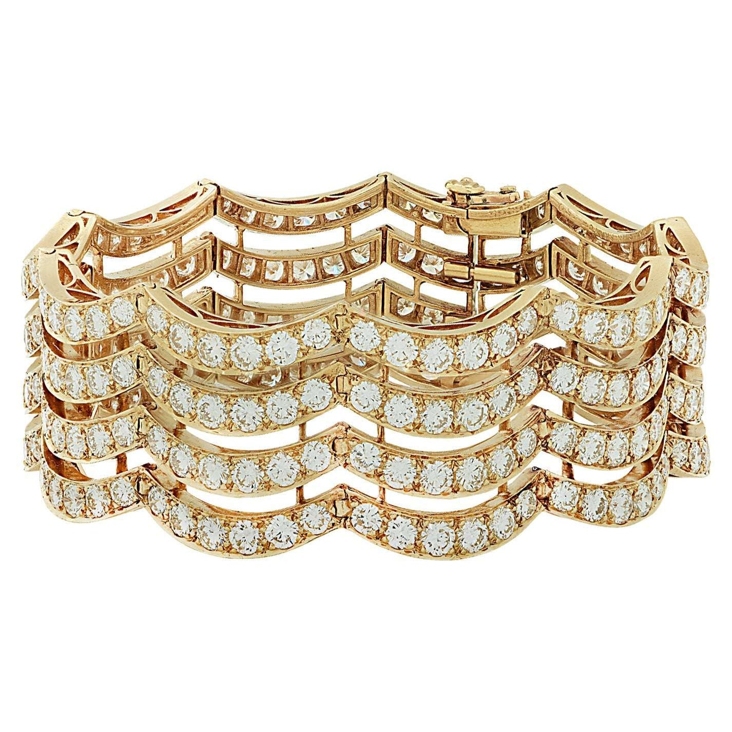 Exquisite Vintage 1970s Van Cleef & Arpels 26 Carat Diamond Bracelet in 18K Yellow Gold by Vivid Diamonds featuring a luxurious wave design embellished with diamonds.