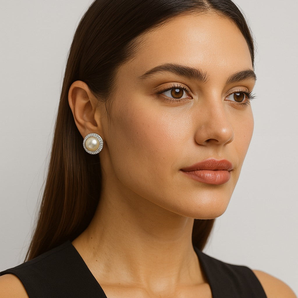 Model showcasing the Exquisite 18K White Gold Pearl & Diamond Earrings - V47314 by Vivid Diamonds, highlighting their elegance and luxurious design.