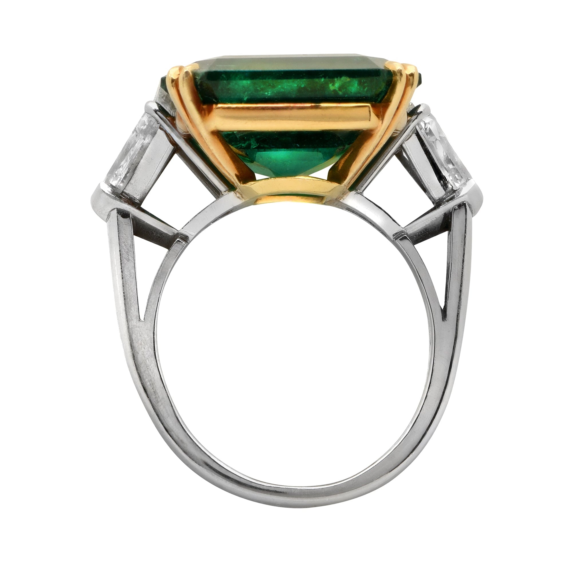Luxury 15.48 Carat Emerald-Cut Emerald and Diamond Platinum Ring by Vivid Diamonds showcasing a vibrant emerald centerpiece, flanked by tapered baguette-cut diamonds, crafted in refined platinum with 18k yellow gold prongs.