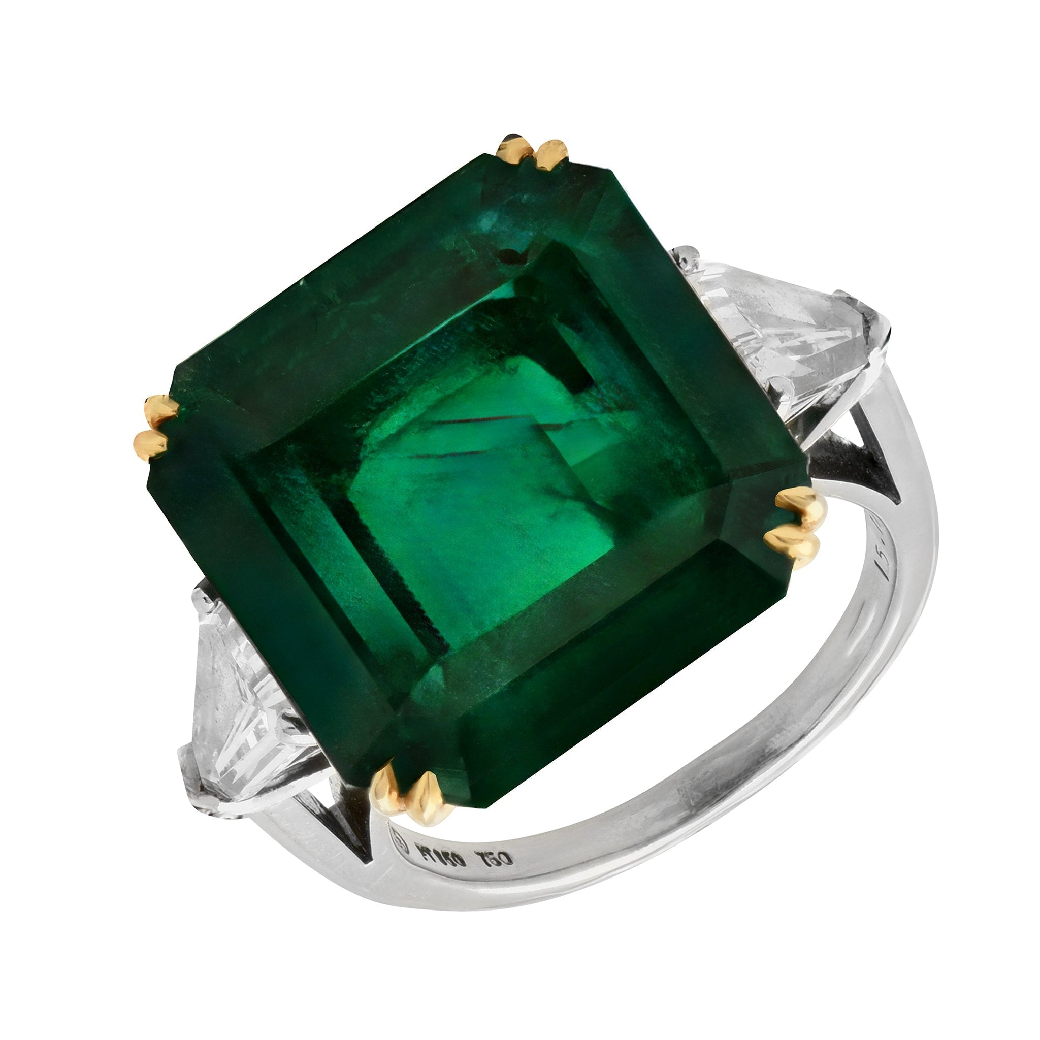 Exquisite luxury 15.48 Carat Emerald-Cut Emerald and Diamond Platinum Ring by Vivid Diamonds featuring a stunning green emerald centerpiece with tapered baguette-cut diamonds, showcasing opulence and exceptional craftsmanship.