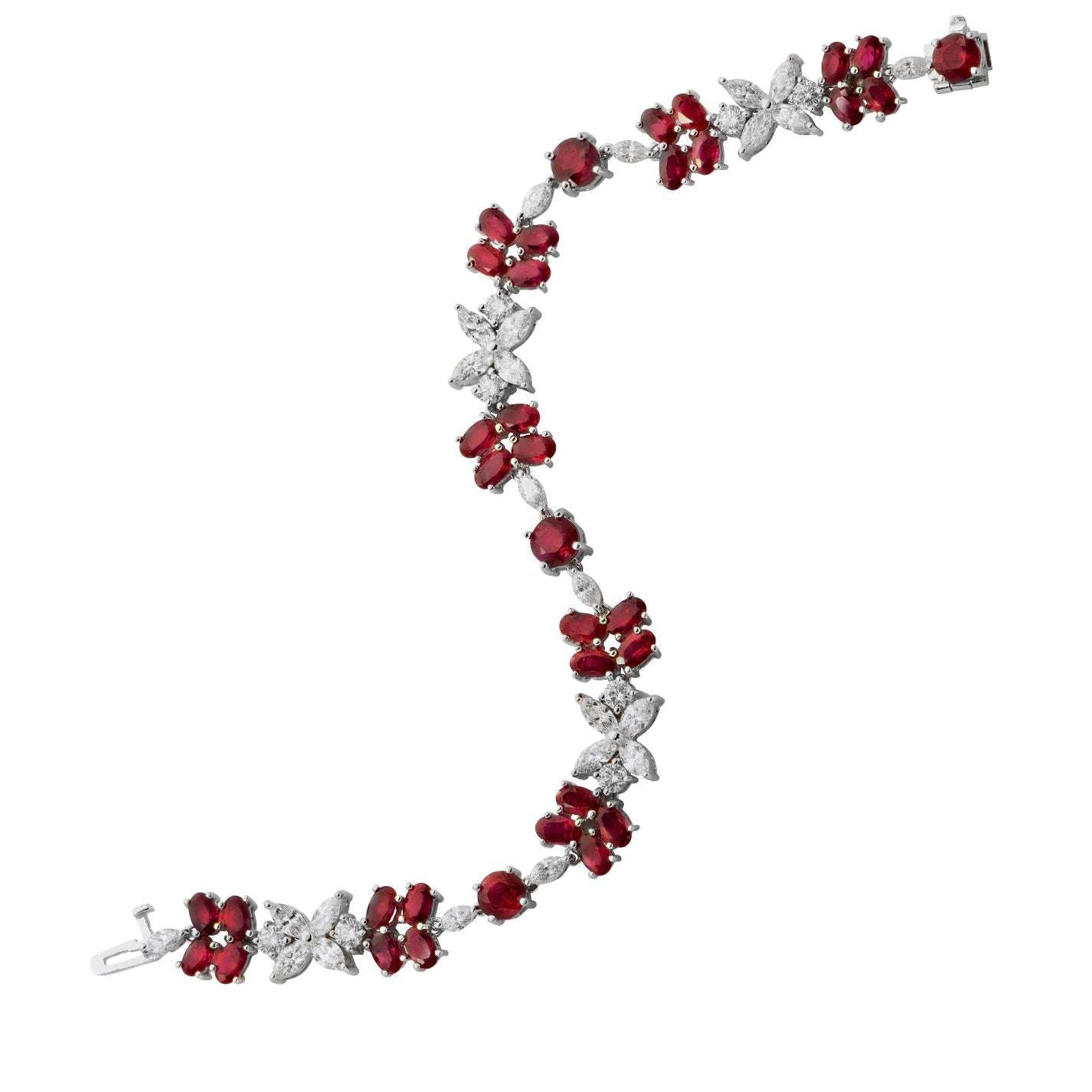 Exquisite Ruby & Diamond Floral Bracelet in 18K White Gold by Vivid Diamonds, featuring 13.37 carats of vibrant rubies and 4.75 carats of brilliant-cut diamonds in an elegant floral design.