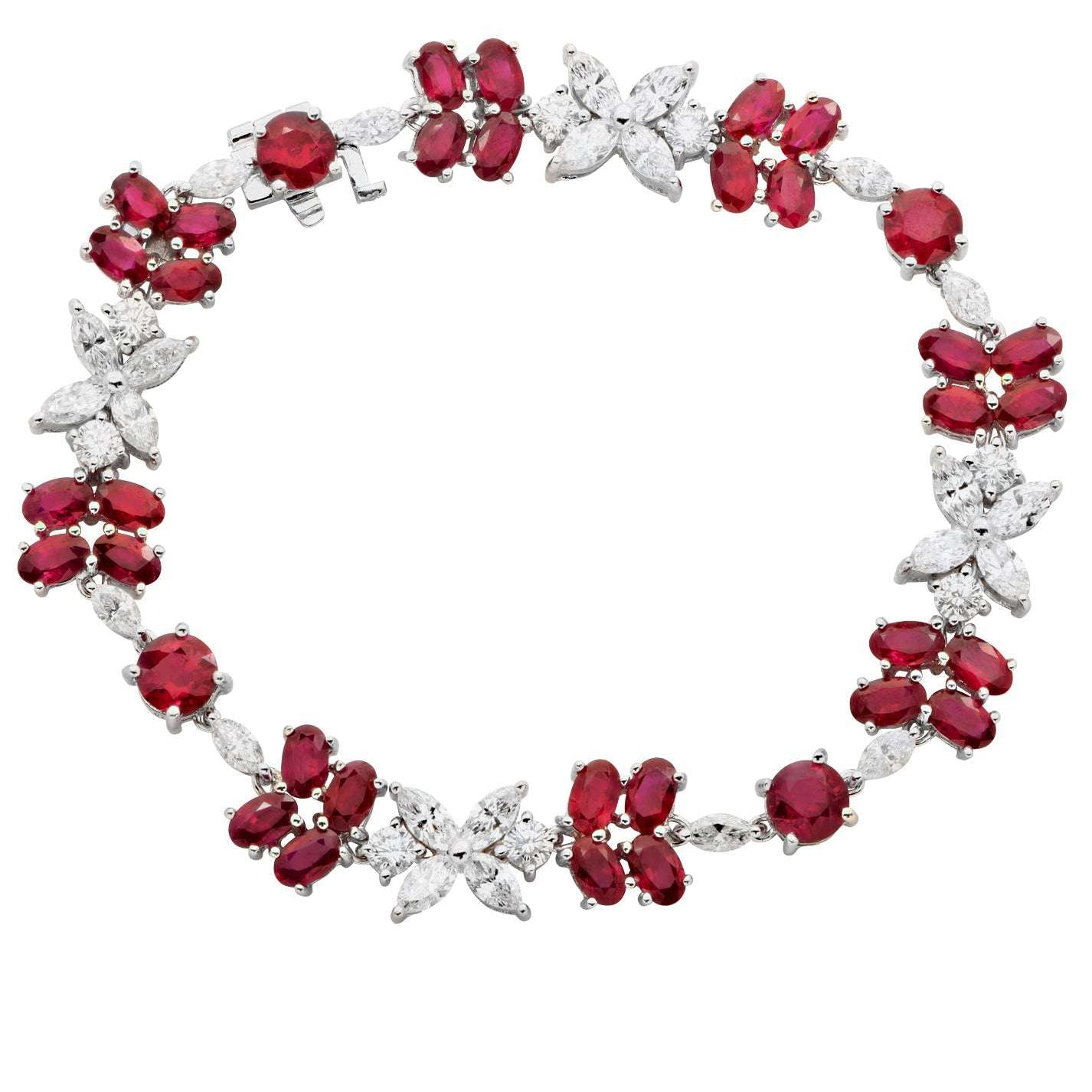 Exquisite Ruby & Diamond Floral Bracelet in 18K White Gold by Vivid Diamonds, showcasing vibrant red rubies and brilliant-cut diamonds in a captivating floral design.