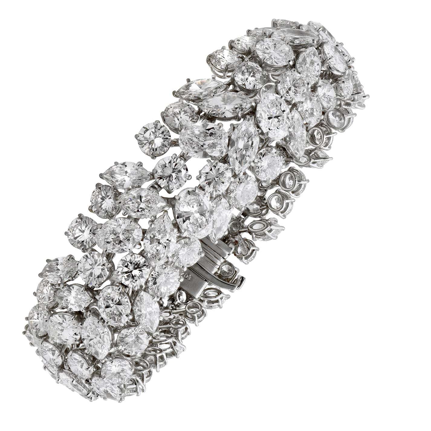 Harry Winston Platinum Diamond Bracelet featuring 63.54 Ct Marquis & Round Brilliant Diamonds, showcasing exquisite design and luxury craftsmanship by Vivid Diamonds.