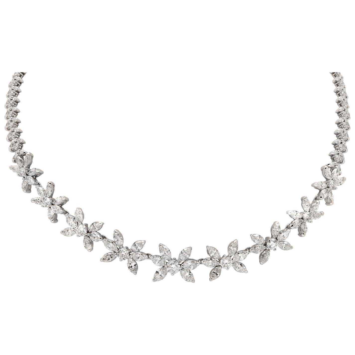 Exquisite 27.00Ct Diamond Floral Necklace by Vivid Diamonds. Crafted in platinum, featuring 159 round and marquise-cut diamonds with G-H color and VS1 clarity, showcasing a delicate floral design.