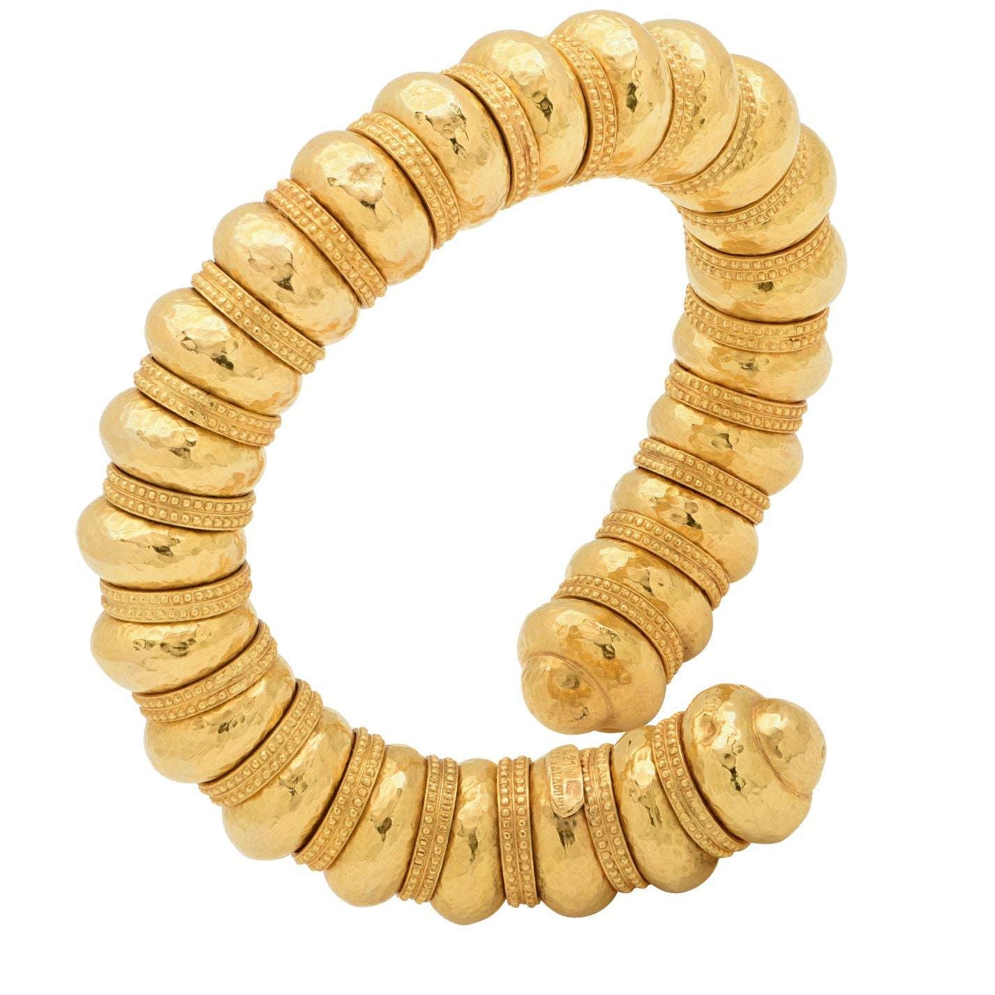 Lalaounis 18K Yellow Gold Hammered Bangle V48214 by Vivid Diamonds showcasing a luxurious and intricate design, featuring a unique hammered texture that reflects timeless craftsmanship.