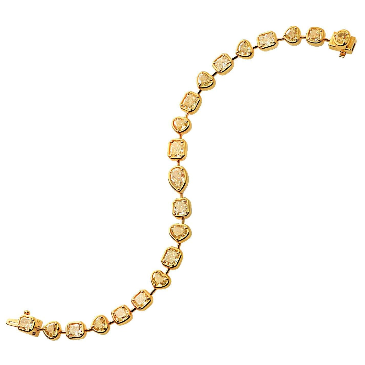 Breathtaking 12.71ct Yellow Diamond Bracelet in radiant 18K Yellow Gold by Vivid Diamonds, showcasing 21 mixed shape yellow diamonds in a luxurious design.