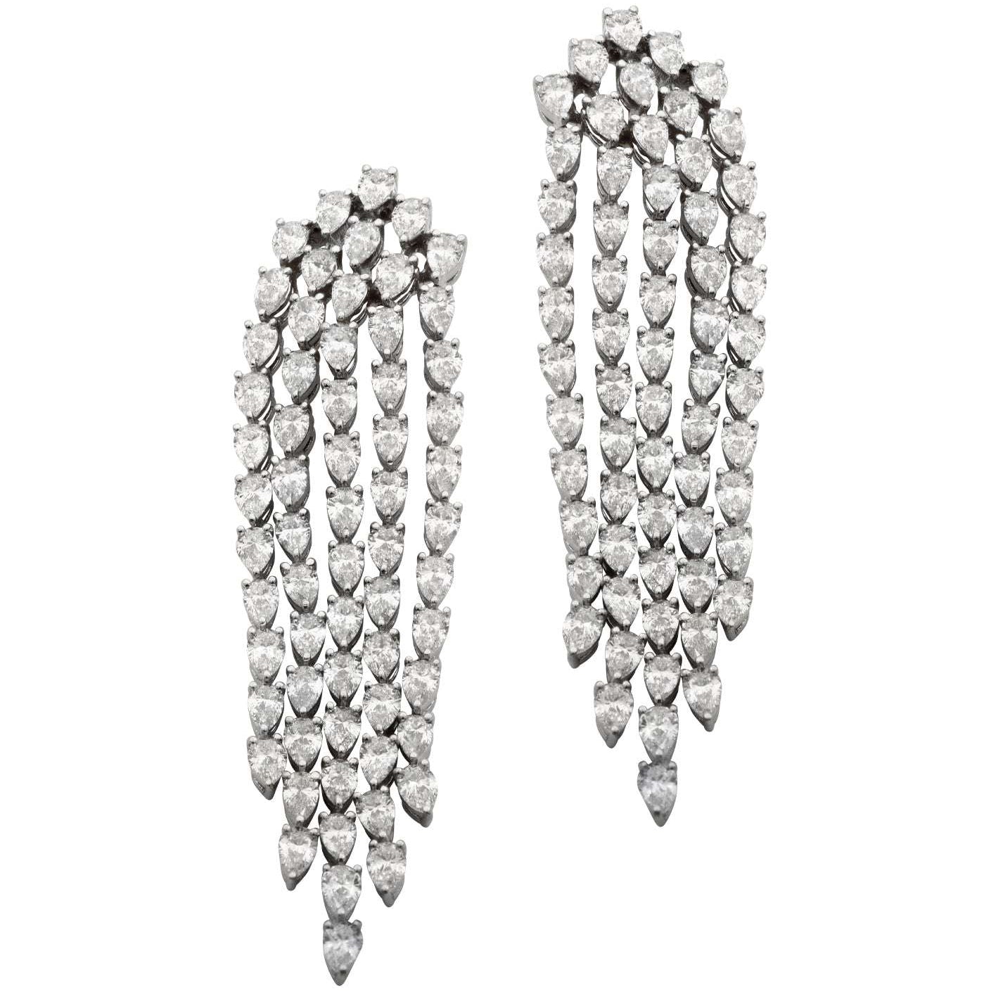 Elegant 18K White Gold Diamond Dangle Earrings with 6.00 Carats Pear-Shaped Diamonds from Vivid Diamonds, showcasing a luxurious design featuring cascading diamonds for a stunning visual effect.