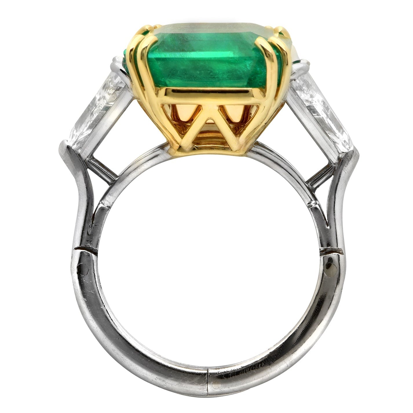 Side view of the exquisite 10.14Ct Vivid Green Emerald & 2Ct Trillion Diamond Ring in Platinum & 18K Yellow Gold by Vivid Diamonds, highlighting the unique setting and design elegance.