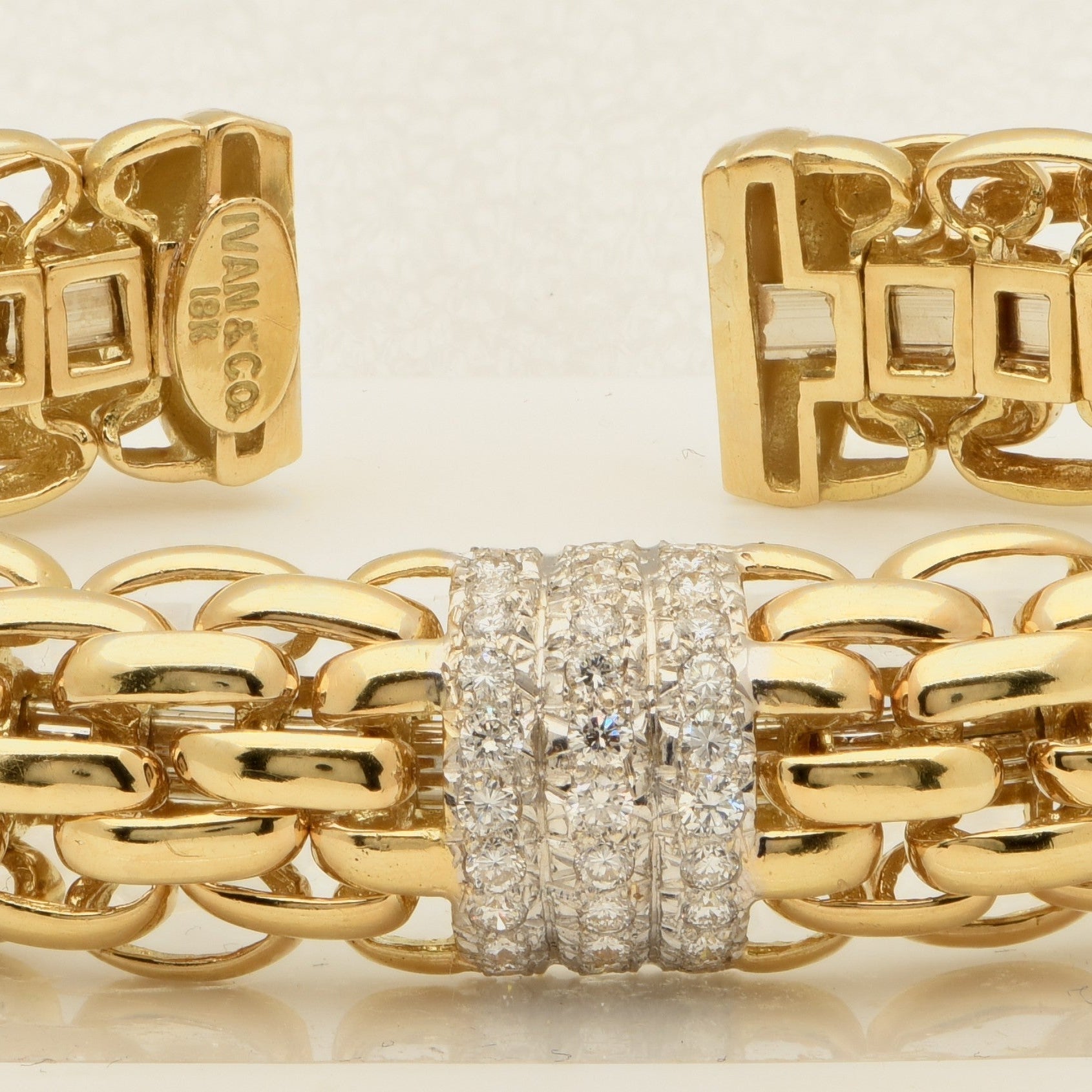 Stunning 18k Yellow & White Gold Diamond Link Bracelet with 2.00ct Round Brilliants from Vivid Diamonds, highlighted by its intricate structure and brilliant sparkle.