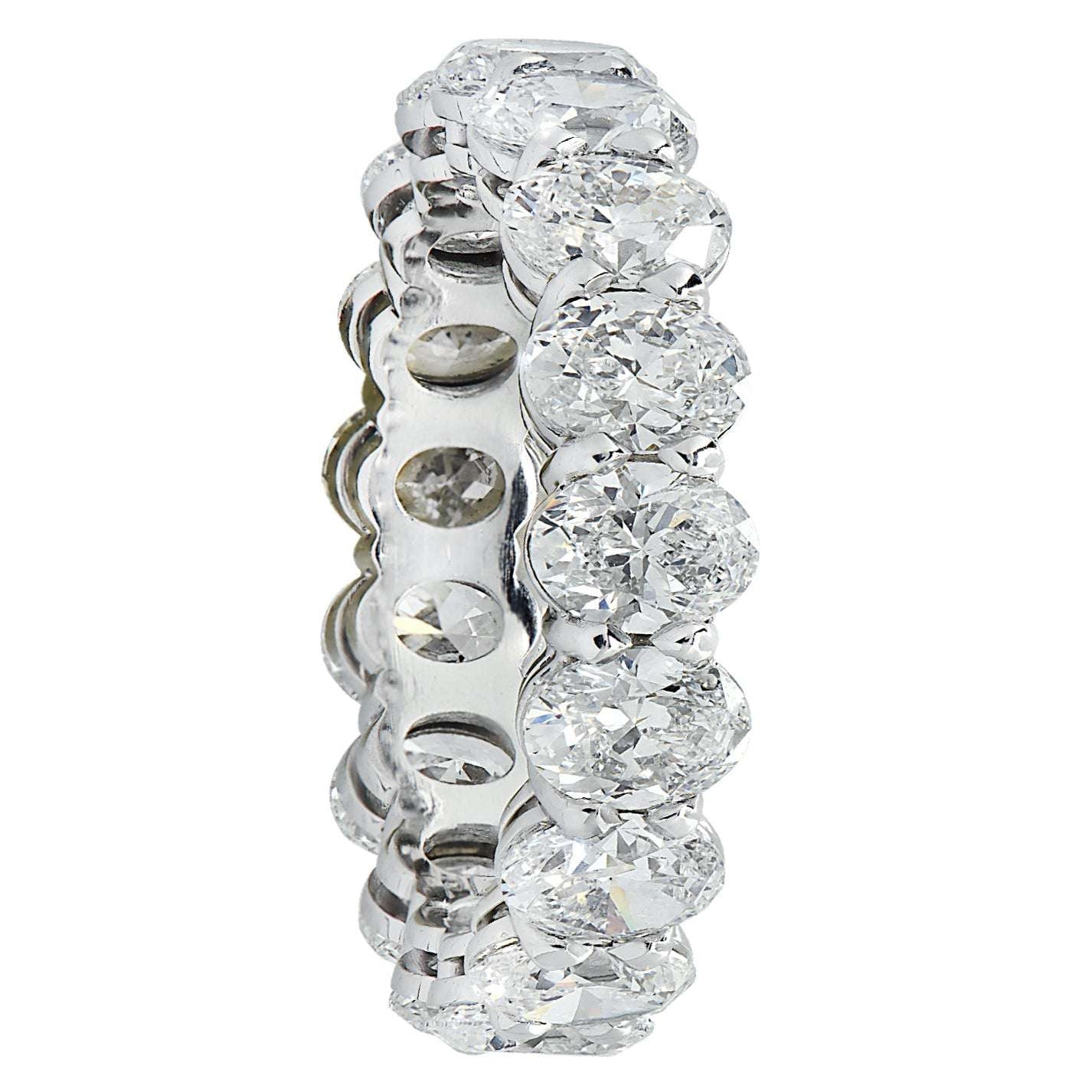 Vivid Diamonds 4.39 Ct Platinum Diamond Eternity Band viewed from the side, featuring 18 radiant oval cut diamonds in a stunning arrangement.