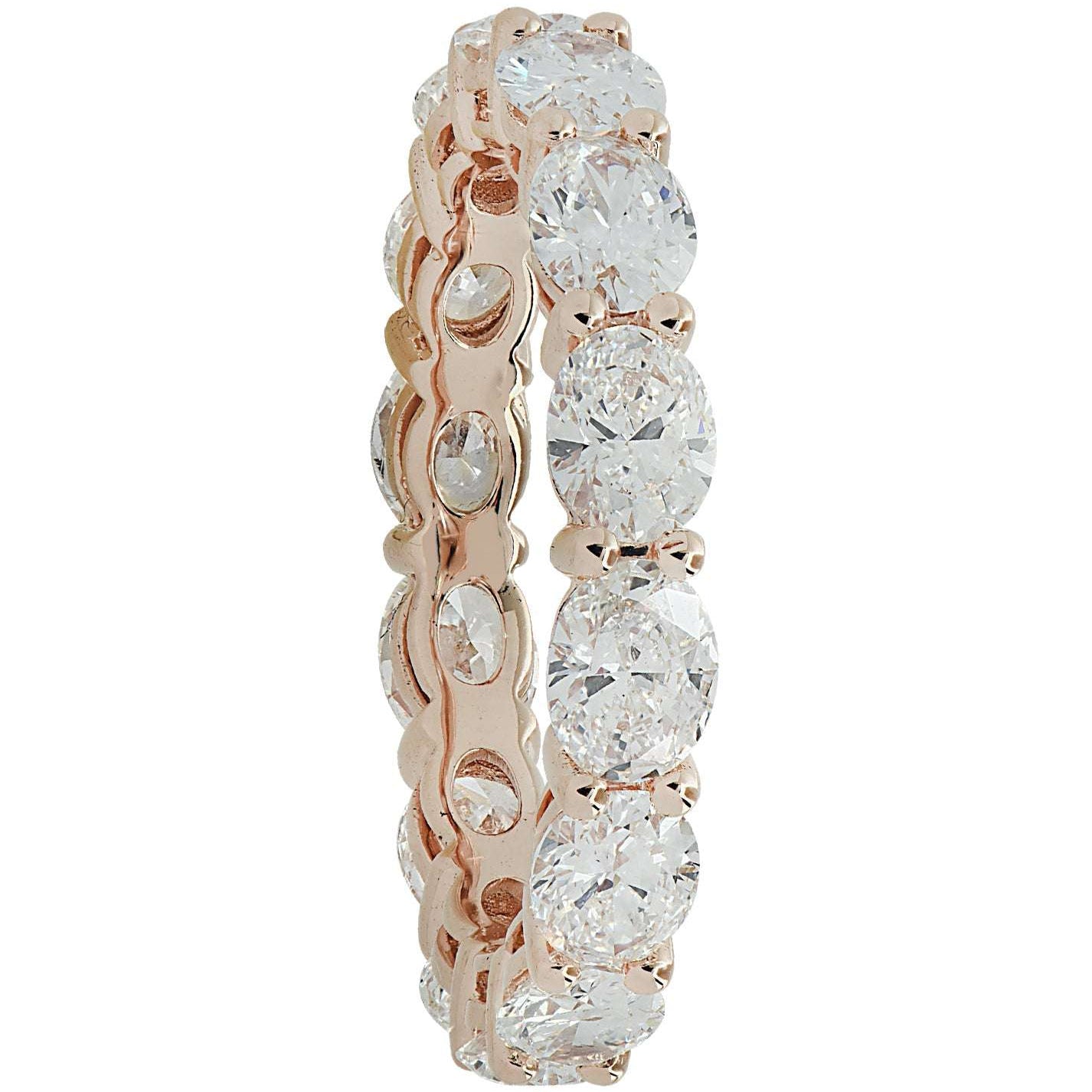 Vivid Diamonds 2.65 Carat East West Diamond Eternity Band showcased in 18K Rose Gold, featuring 14 oval cut D-E VVS diamonds, radiating brilliance and elegance.