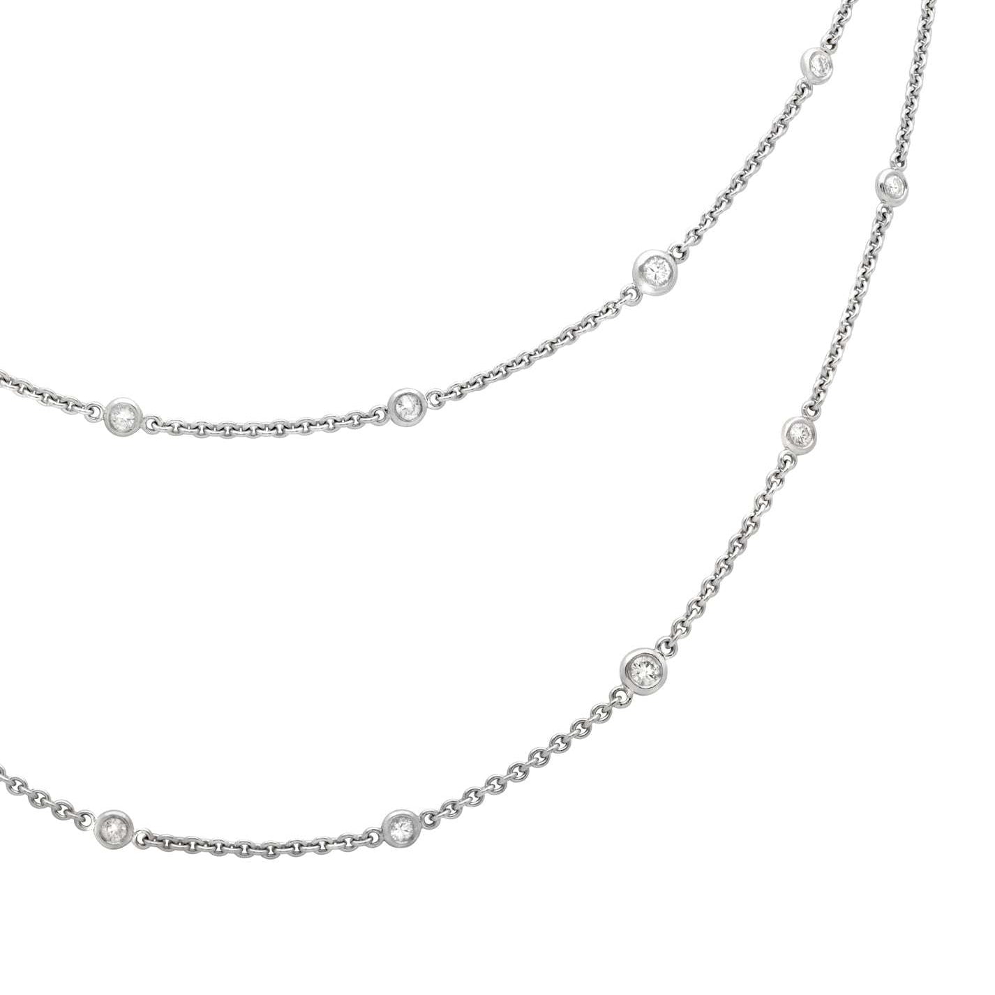 Elegant 18K White Gold Diamond Necklace with 2.2ct Round Brilliant Diamonds by Vivid Diamonds displayed gracefully against a white background, showcasing the necklace's exquisite design and diamond arrangement.