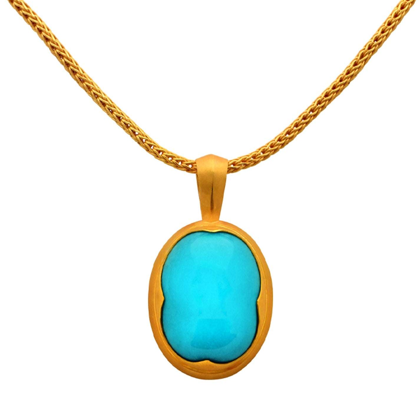 Close-up of the exquisite Sleeping Beauty Turquoise Necklace by Vivid Diamonds, emphasizing the vibrant turquoise stone and 22k gold chain.