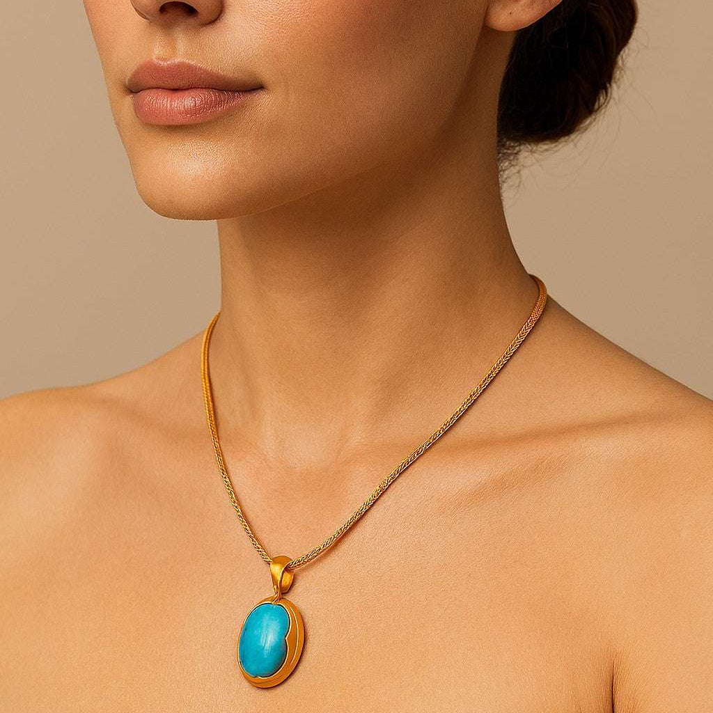 Model showcasing the Sleeping Beauty Turquoise Necklace from Vivid Diamonds, highlighting the stunning turquoise stone against a chic outfit.