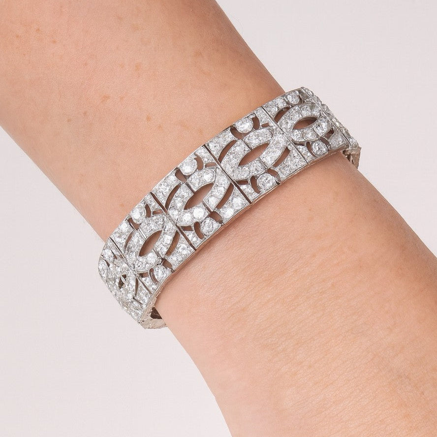 Luxury 11ct Platinum French-Style European Cut Diamond Bracelet by Vivid Diamonds worn on a wrist, highlighting its exquisite craftsmanship and timeless style.