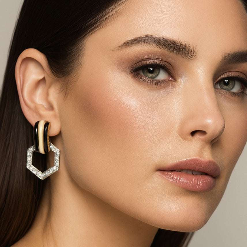 A model elegantly wearing David Webb 2.79 Ct Diamond, Platinum & 18K Yellow Gold Enamel Earrings, highlighting their sophisticated style and luxurious craftsmanship by Vivid Diamonds.