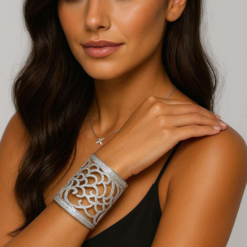 Elegant model showcasing the Italian 18K White Gold Wide Open Work Cuff Bangle adorned with 6 Carat Round Brilliant Cut Diamonds by Vivid Diamonds, highlighting its exquisite design and luxurious appeal.