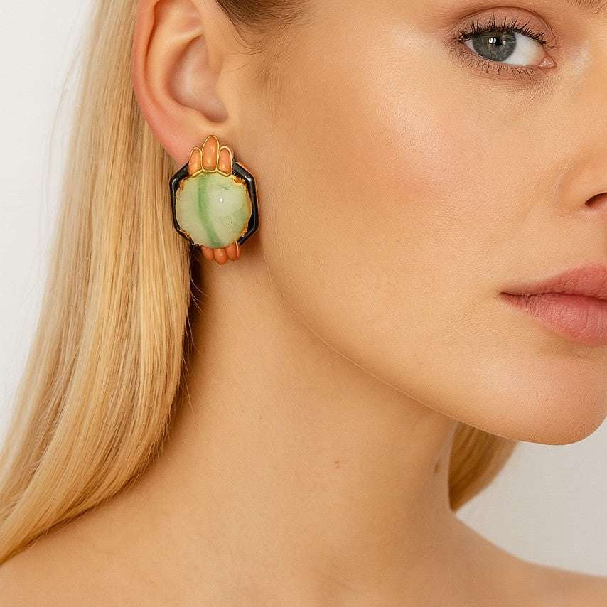 Elegant model showcasing stunning 18K yellow gold coral, jade & onyx earrings by Vivid Diamonds, highlighting vintage-inspired design with intricate details.