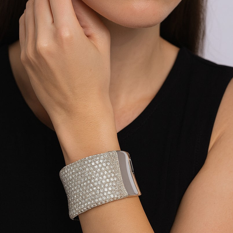 Vivid Diamonds 27.72 Carat Diamond Bangle worn elegantly on a wrist, highlighting the exquisite craftsmanship and luxurious diamond detail for a sophisticated look.