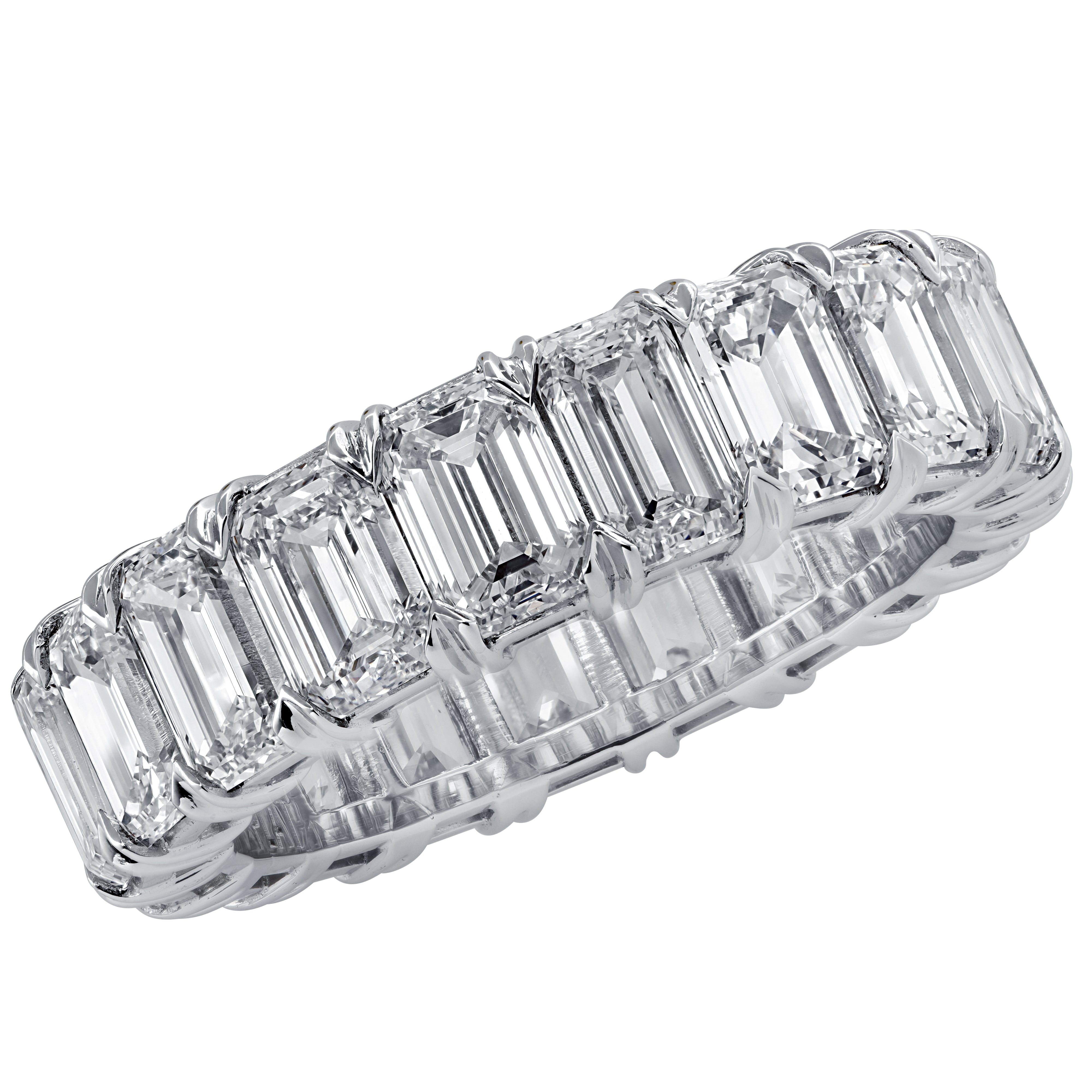 Vivid Diamonds 5.12 Ct Emerald Cut Diamond Eternity Band in Platinum featuring 22 VVS Clarity Diamonds, showcasing stunning craftsmanship and luxurious design.