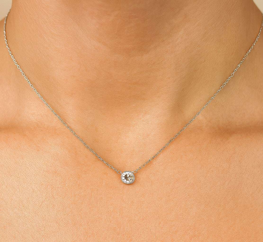 Elegant Vivid Diamonds 1.03 Ct Old European Cut Diamond Pendant Necklace in 18k White Gold worn elegantly, showcasing its beautiful design and luxurious appeal.