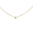 Close-up view of the Cartier D'Amour Diamond Necklace in 18k Yellow Gold, highlighting its minimalist design and sparkling round diamond from Vivid Diamonds.