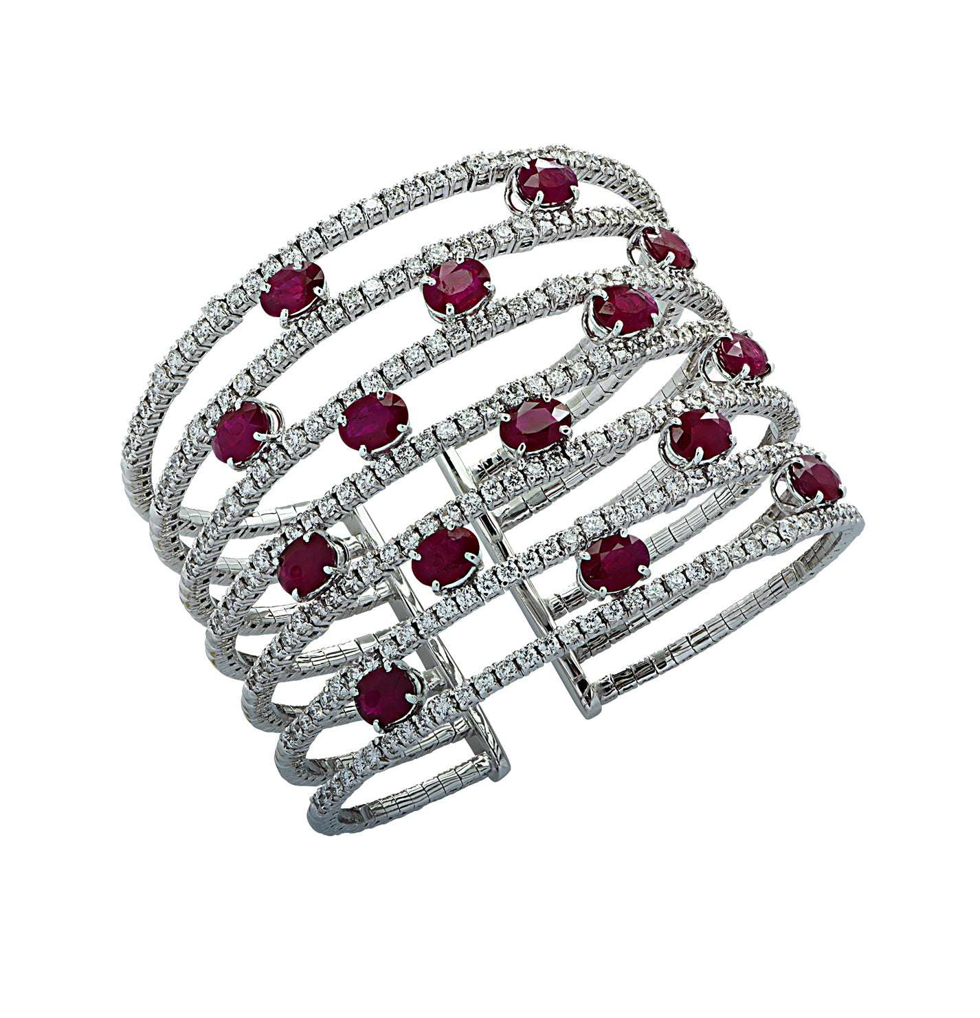 Elegant Diamond & Ruby Cuff Bangle Bracelet by Vivid Diamonds, featuring 15 vivid oval rubies and G-color, VS-clarity round brilliant diamonds set in 18K white gold.