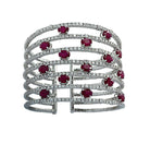Stunning close-up of the Diamond & Ruby Cuff Bangle Bracelet by Vivid Diamonds, highlighting the interplay of rubies and diamonds intricately crafted in 18K white gold.
