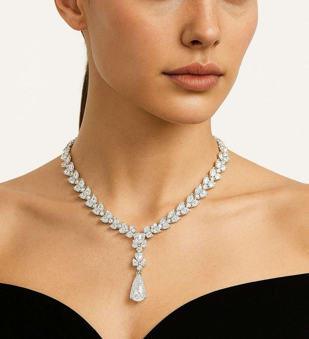 Elegant Vivid Diamonds 56 Carat Platinum Diamond Drop Necklace displayed on a model, showcasing the exquisite design and radiant diamonds that enhance sophistication.
