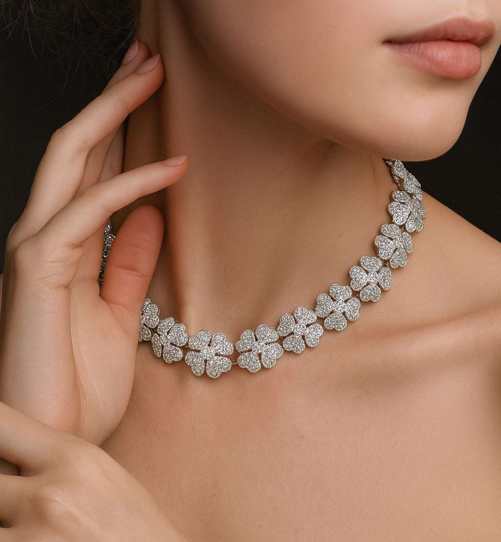 Elegant model wearing the Cartier Pave Diamond Clover Necklace from Vivid Diamonds, featuring intricate diamond clover motifs in luxurious 18k white gold.