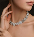 Elegant model wearing the Cartier Pave Diamond Clover Necklace from Vivid Diamonds, featuring intricate diamond clover motifs in luxurious 18k white gold.