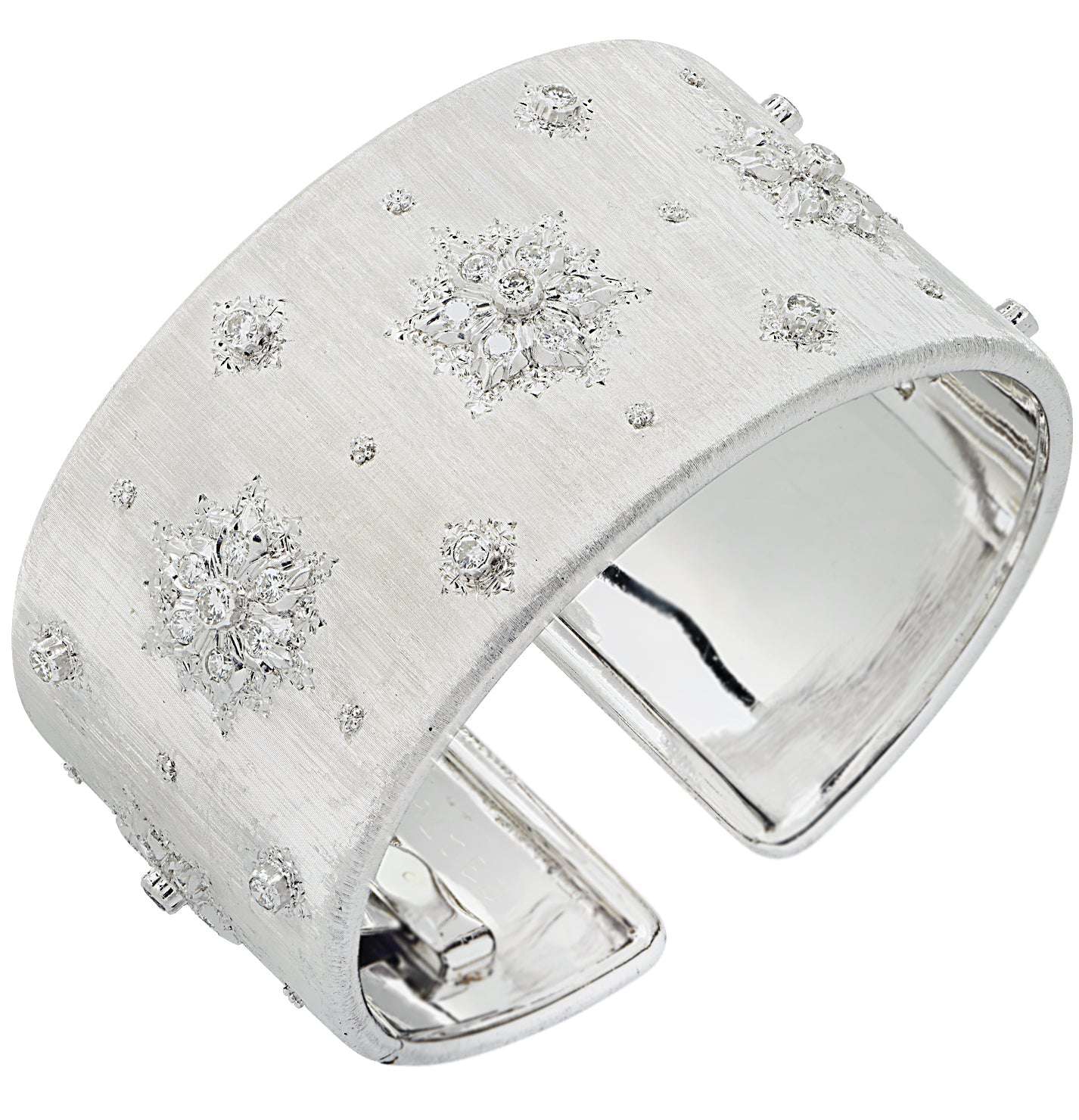Luxury Buccellati Italy 18K White Gold Diamond Wide Cuff Bangle showcasing intricate star motifs and hand-engraved finish, available from Vivid Diamonds.