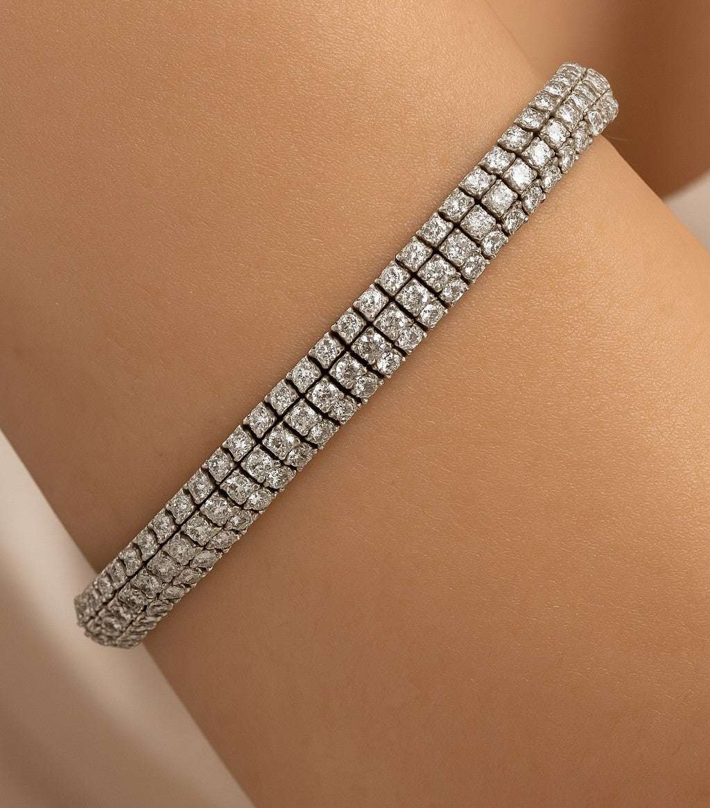 Close-up view of the 11.15ct Round Brilliant Diamond Tennis Bracelet by Vivid Diamonds, demonstrating the brilliance and sparkle of finely set diamonds on a wrist.