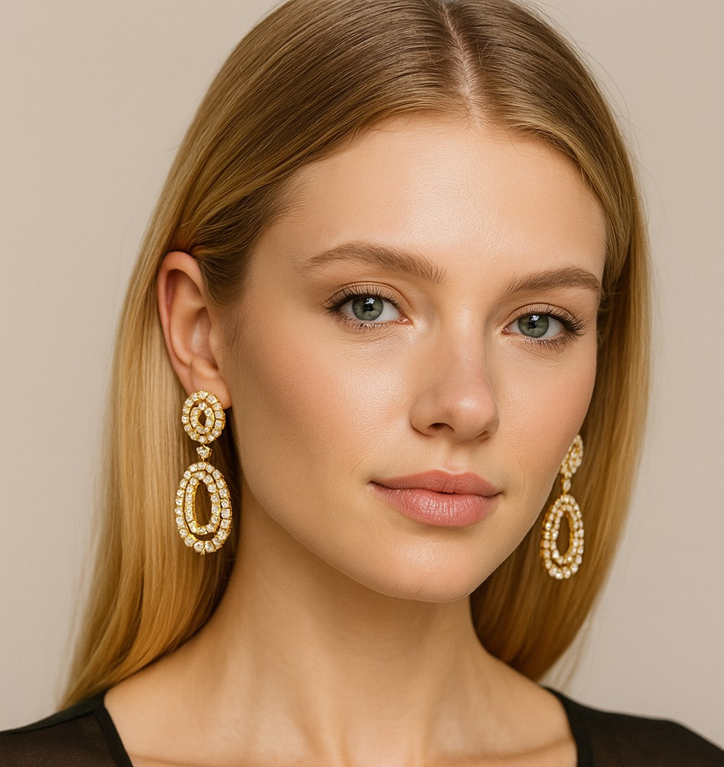 Elegant model showcasing the Stunning 18K Yellow Gold Pearl & 7.50 Ct Diamond Earrings by Vivid Diamonds, highlighting their luxurious design and intricate craftsmanship.