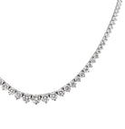 Exquisite display of the diamond necklace V48490 by Vivid Diamonds, highlighting the elegant arrangement of sparkling round brilliant diamonds.